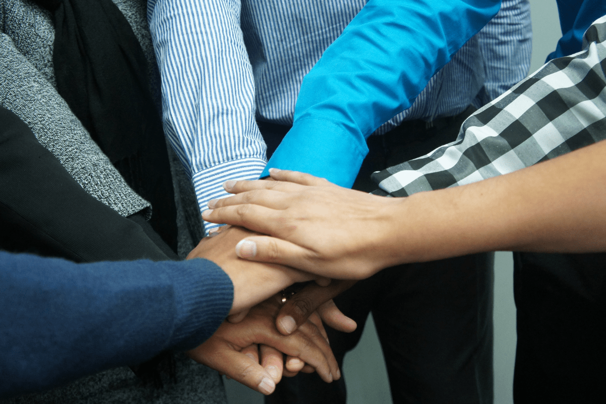 Group of People Hands on top of each other
